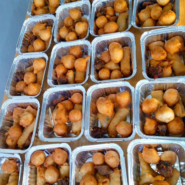 Rows of small chops packed in foil containers